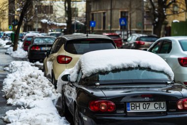 Winter season and icy cars on the road in the morning rush hour 