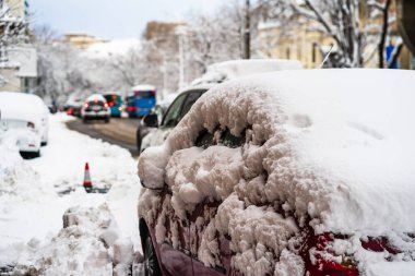 Cars covered with snow from the first snow fall of the year. Win