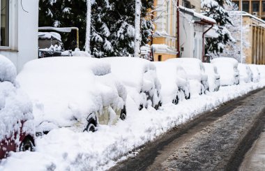 Cars covered with snow from the first snow fall of the year. Win