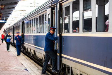 Train crew doing the last checking on the platform at the Buchar
