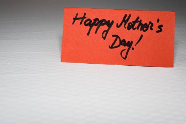 Happy mother`s day writing love text for mother on paper. Label 