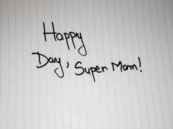 Happy day super mom writing love text for mother on paper. Label