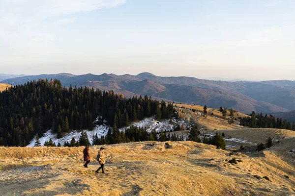 Tourists relaxing. Beautiful landscape of snowy mountains. Beaut