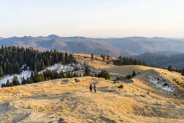 Tourists relaxing. Beautiful landscape of snowy mountains. Beaut