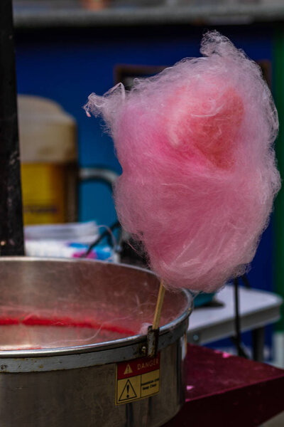 Tasty cotton candy for sale in a park, close up photo.