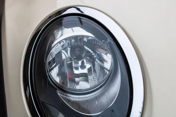 Close up photo of modern car, detail of headlight. Headlight car Projector LED of a modern luxury technology and auto detail. Bucharest, Romania, 2020.