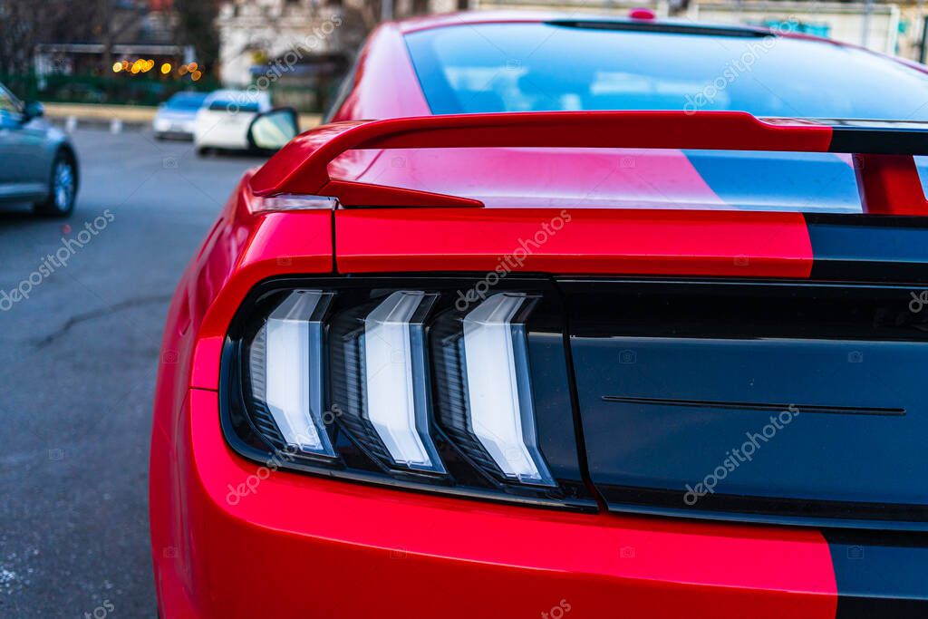 Details of modern car Ford Mustang GT. Backlights of car modern luxury technology and auto detail. Bucharest, Romania, 2020.