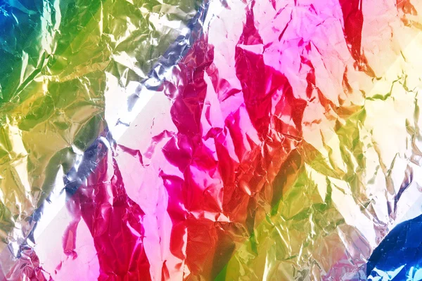 Carta da imballaggio arcobaleno stropicciata con effetto lucido. Da vicino. . — Foto Stock