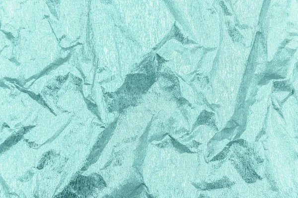 折皱的薄荷绿色包装纸，有光泽效果. — 图库照片