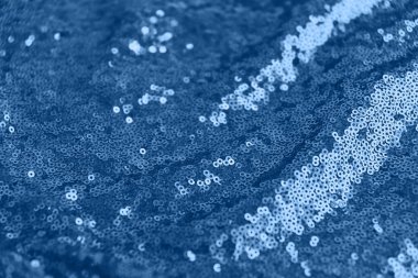 Pullu parlak kumaş, soyut arkaplan tonlu mavi renk.