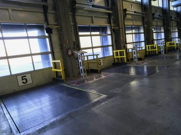 Loading docks for trucks in warehouse, angle view — Stock Photo, Image