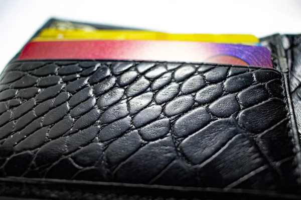 Black wallet with blurry credit cards closeup — Stok fotoğraf