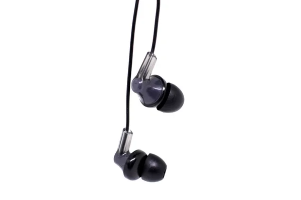 Black headphones as if hanging from above on a white background — Stock Photo, Image