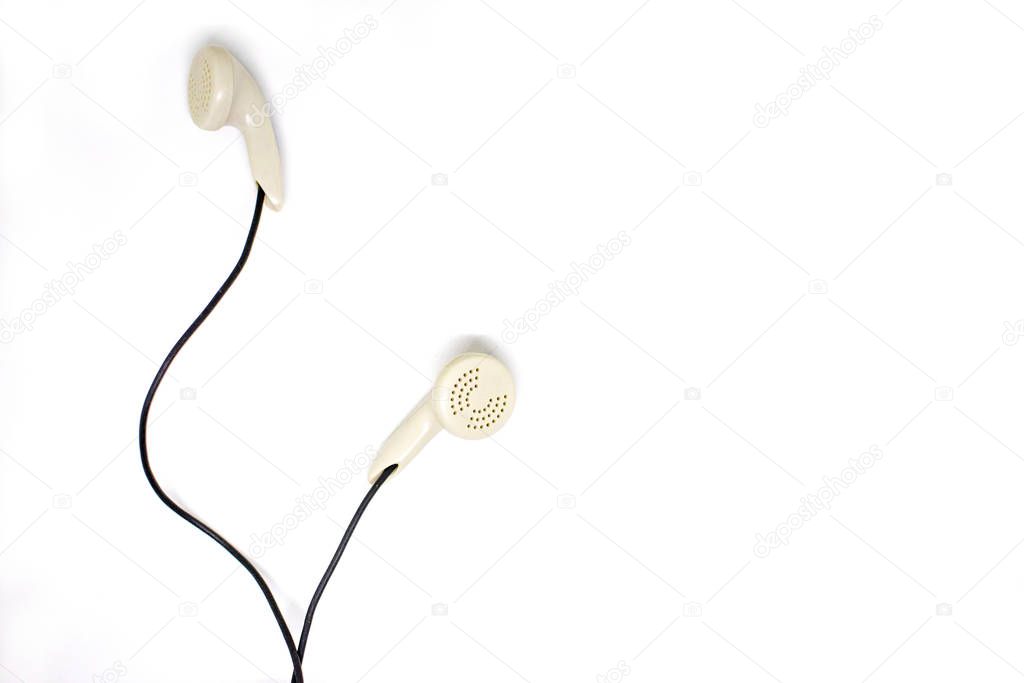 White headphones on a white background.Digital music concept.Close-up.