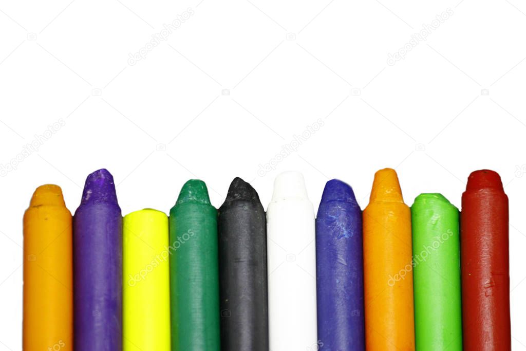 Multi-colored pieces of chalk isolated on white background.