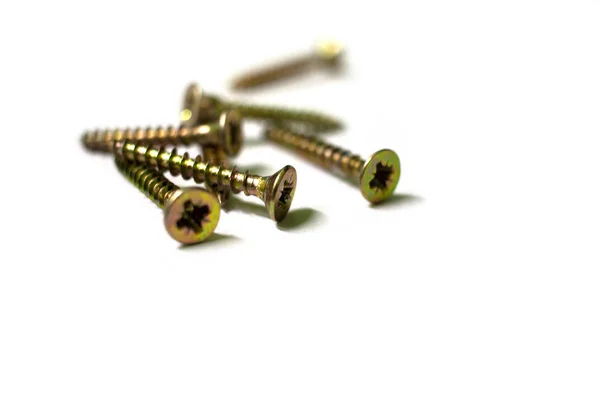 Set of screws close up. Macro photo of screws on a white background. Macro photo screws, screw background, steel screw, selective focus. — 스톡 사진