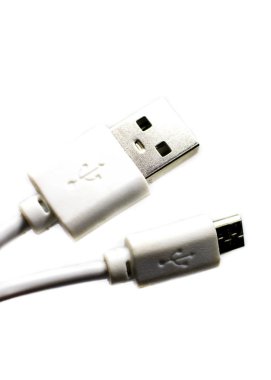White micro USB cable BM, selective focus, close-up.