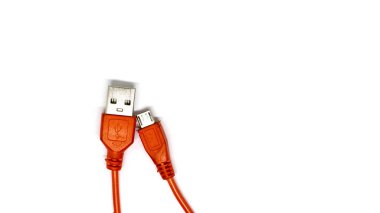 White micro USB cable BM, selective focus, close-up.
