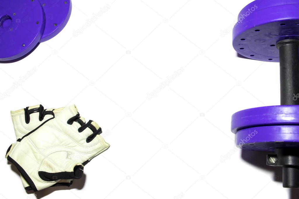 Sports accessories. Dumbbells, gloves, on a white background. Top view with copy space. Fitness, sport and healthy lifestyle concept.