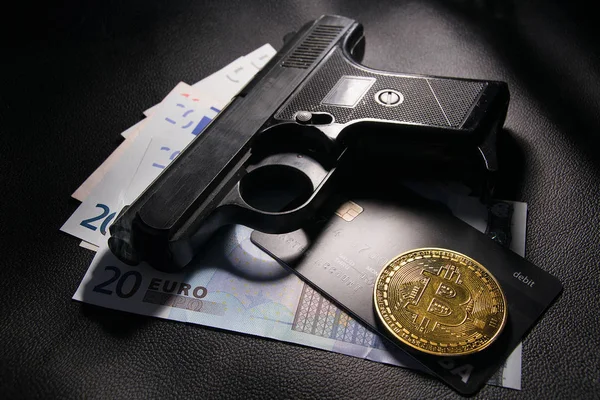 criminal Euro money and gun in the light