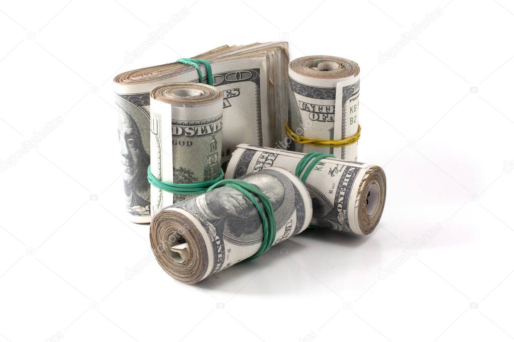 many rolls of money are folded and tied with an elastic band isolated