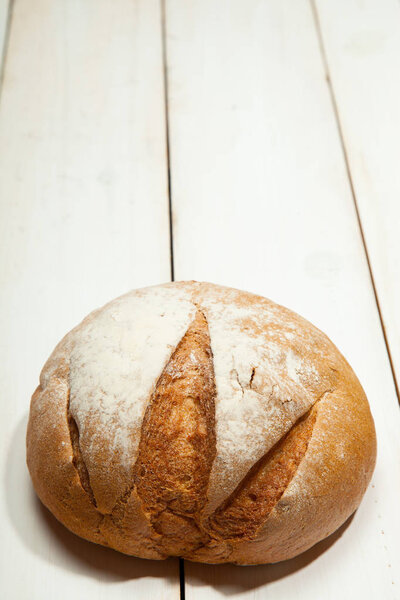 Bread on a white wooden background