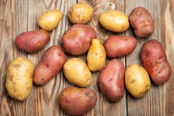 Potatoes on a rustic background — Stock Photo, Image