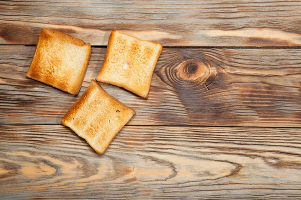 Bir rustik ahşap arka plan üzerinde tost — Stok fotoğraf