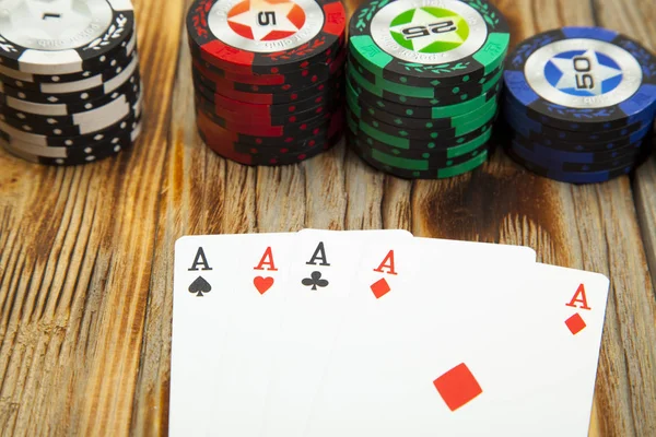 Combination of card game poker on the old wooden table