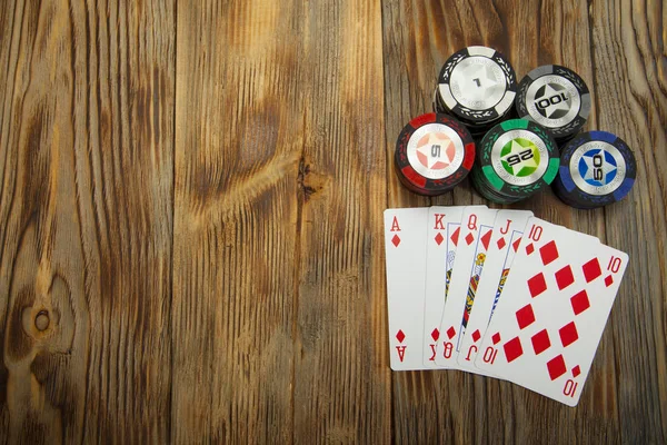 Combination of card game poker on the old wooden table