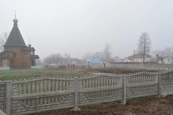 Fog. Small rural churches — Stock Photo, Image
