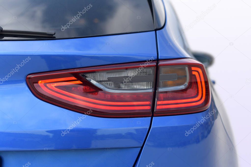 the tail lights on a luxury passenger car