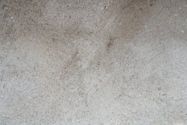 Doku, gri alçılı duvar, kaba yüzey, ince kum ve çimento..