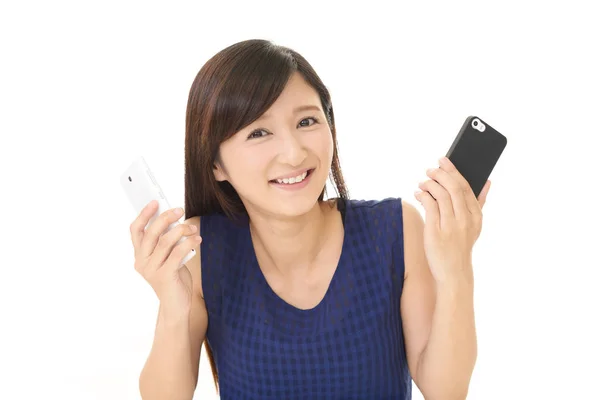 Woman with smart phones — Stock Photo, Image