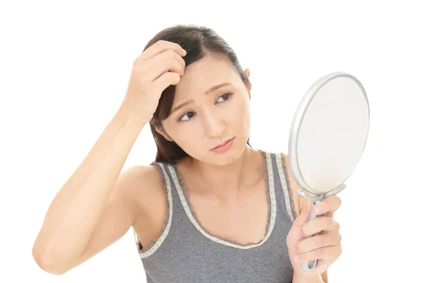 Woman looking unhappy with her hair — Stock Photo, Image