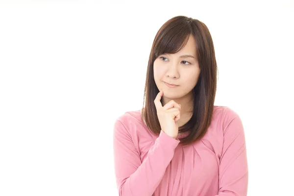 Uneasy Asian woman — Stock Photo, Image