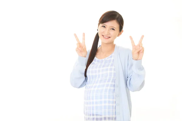 Mujer embarazada sonriente —  Fotos de Stock