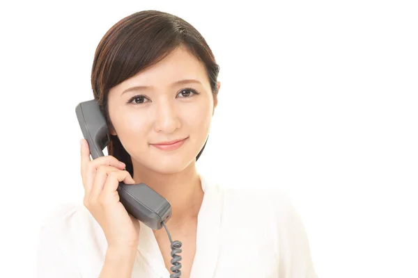 Donna con un telefono — Foto Stock