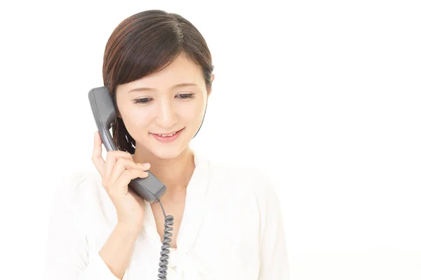 Femme avec un téléphone — Photo