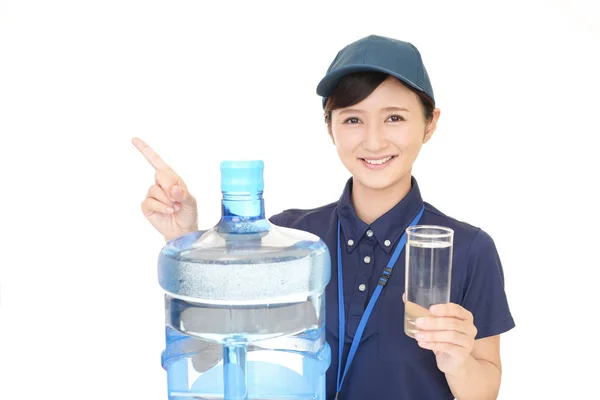 Worker with a container of water — Stock Photo, Image