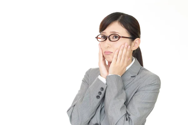 Uneasy Asian business woman — Stock Photo, Image