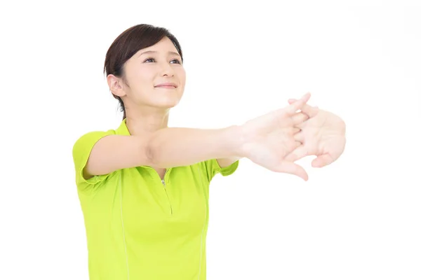 Hermosa mujer haciendo estiramiento — Foto de Stock