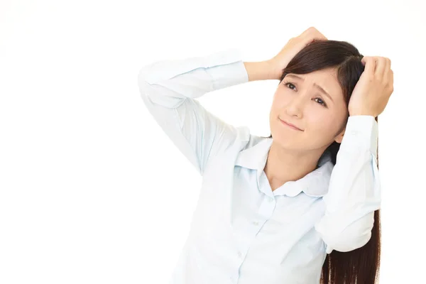 Uneasy Asian woman — Stock Photo, Image