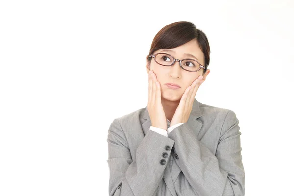 Uneasy Asian business woman Stock Picture