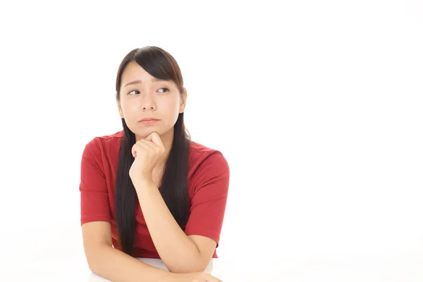 Uneasy Asian woman — Stock Photo, Image