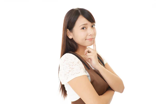 Asian housewife in apron — Stock Photo, Image