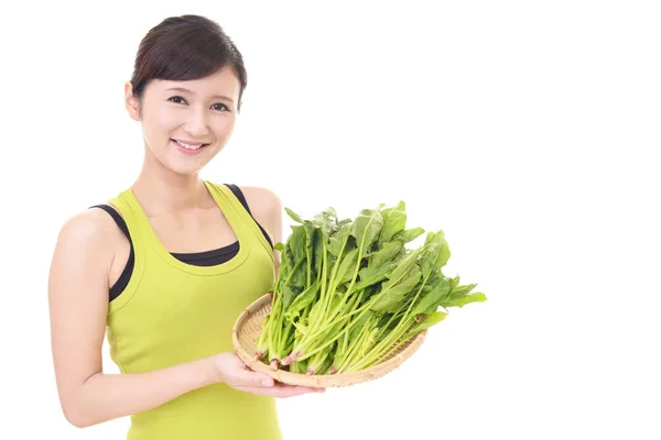 Femme exploitant des légumes — Photo