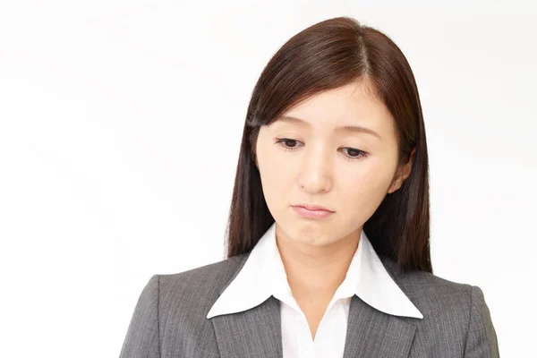 Depressed Asian business woman — Stock Photo, Image