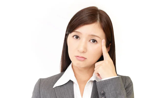 Uneasy Asian business woman — Stock Photo, Image