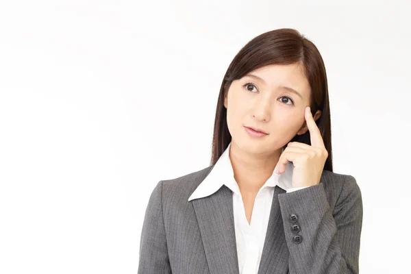 Ongemakkelijke Aziatische zakenvrouw — Stockfoto